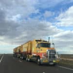 yellow truck on highway