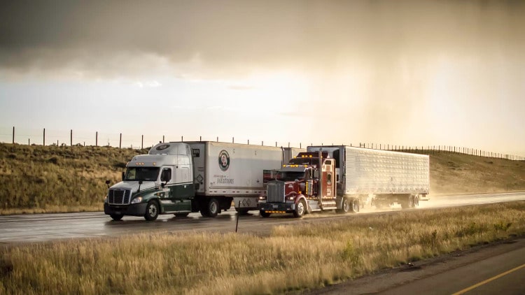 two trucks on the hwy