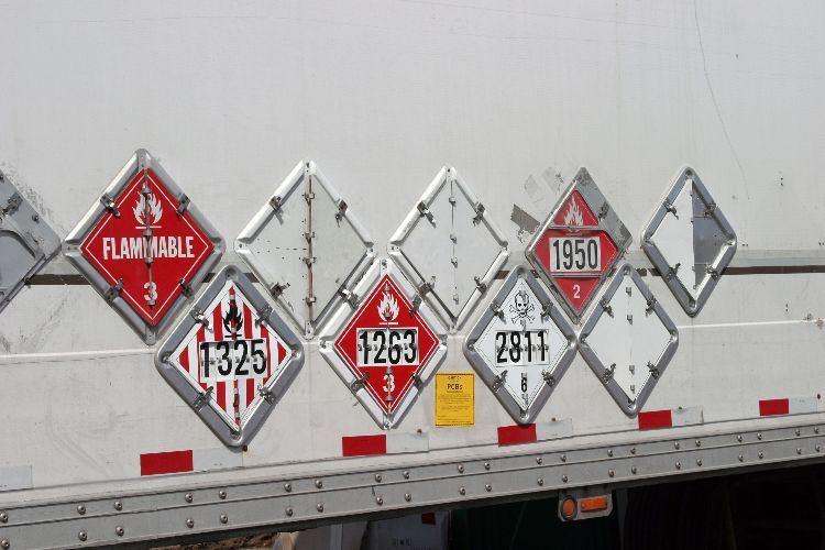 truck with various hazardous placards