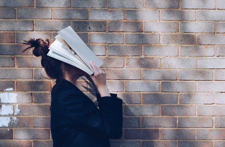 woman holding book